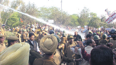 The Delhi police using water cannons to disperse the BJP activists